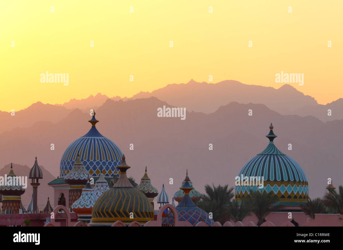 ALF LEILA WA LEILA FANTASIA shopping center. East of mosques domes against mountains during a sunset. Stock Photo