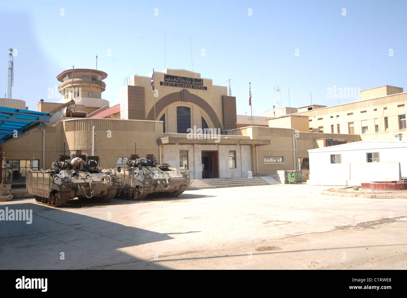 British Army MCV-80 Warrior infantry fighting vehicles parked outside headquarters in Iraq. Stock Photo