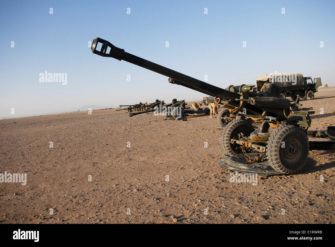 Howitzer 105mm light guns are lined up at Camp Bastion, Afghanistan. Stock Photo