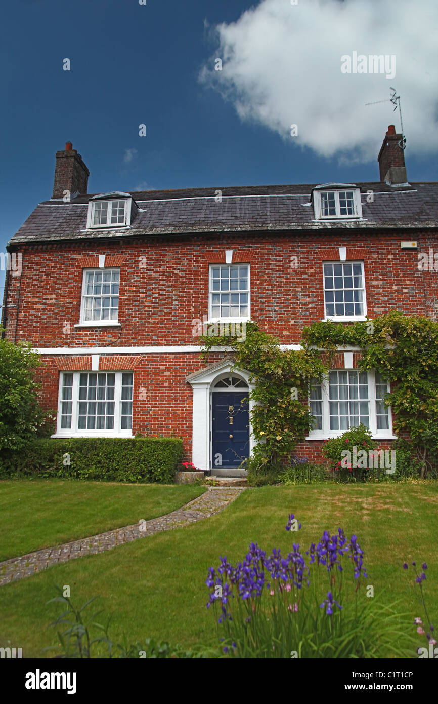Elegant red brick house in the village of Cerne Abbas, Dorset, England