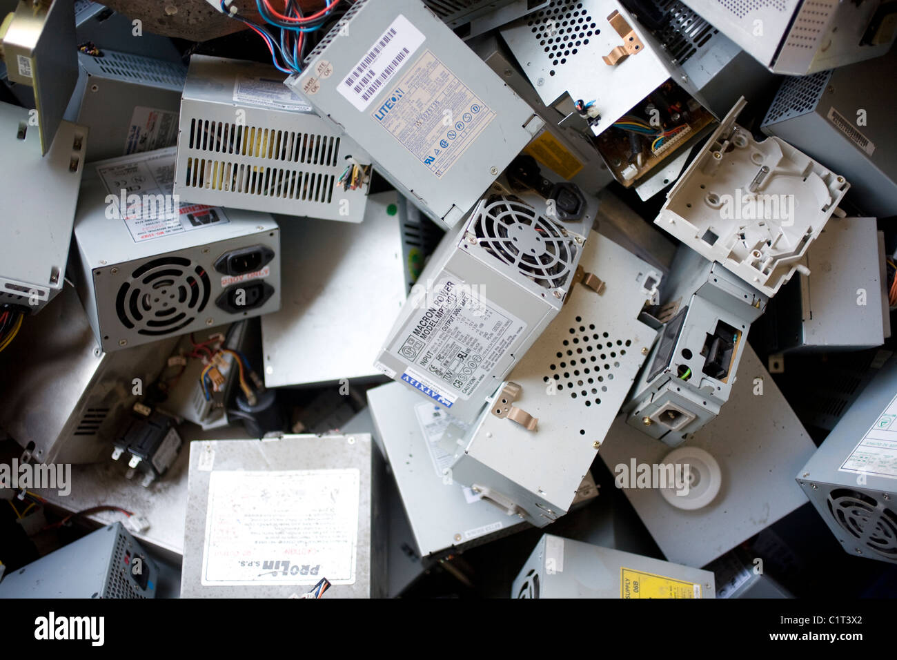 Old disused computer parts in a pile waiting for recycling Stock Photo