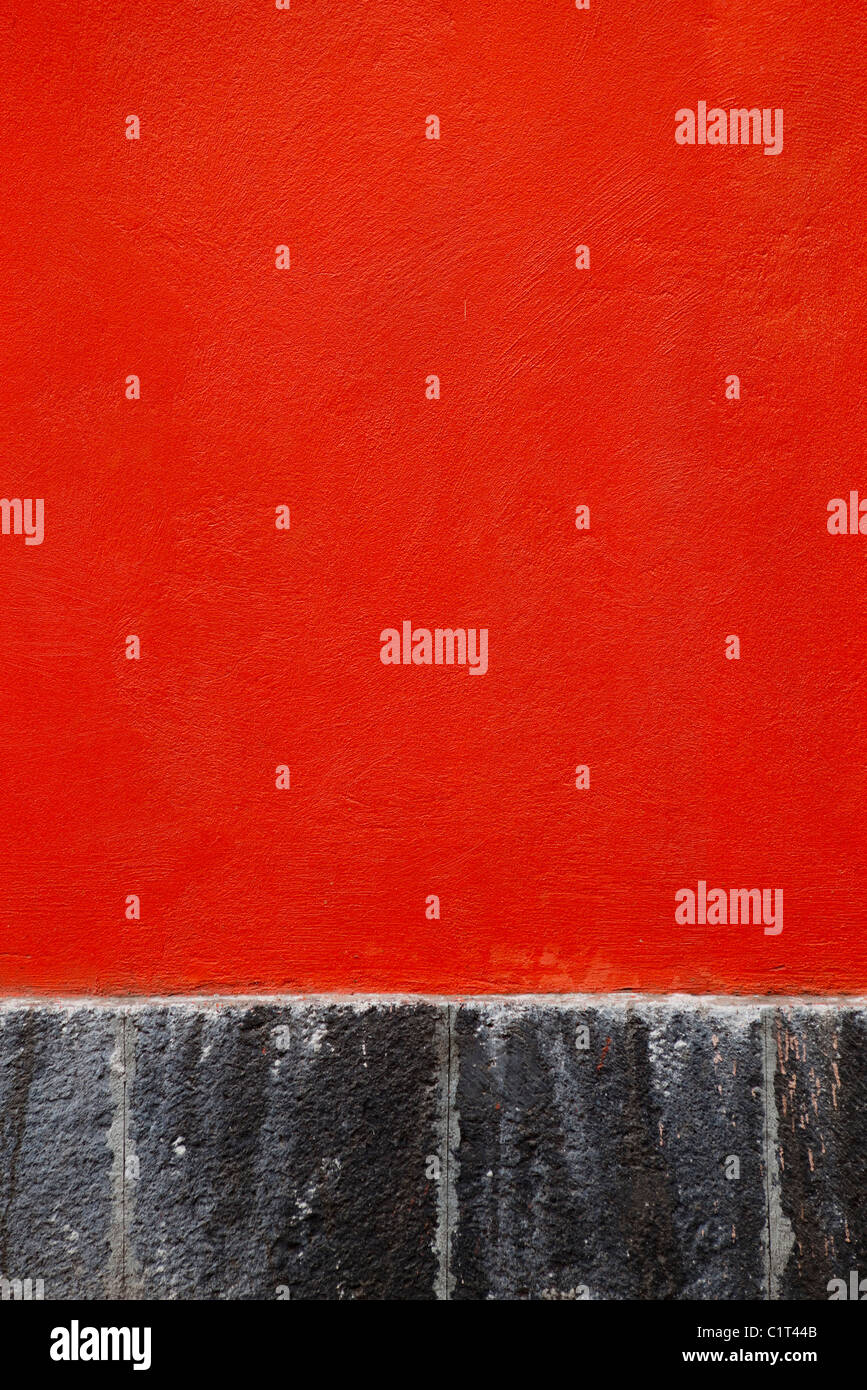 Red stucco wall, close-up Stock Photo