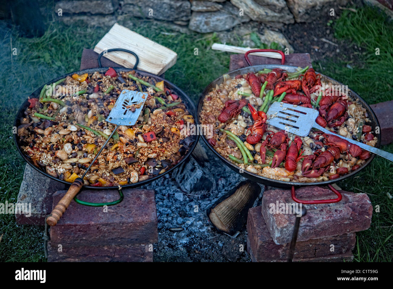 Paella cooking on an open fire Stock Photo Alamy