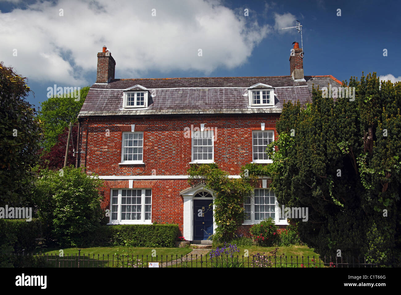 Elegant red brick house in the village of Cerne Abbas, Dorset, England, UK 'England's most desirable village 2008' Stock Photo