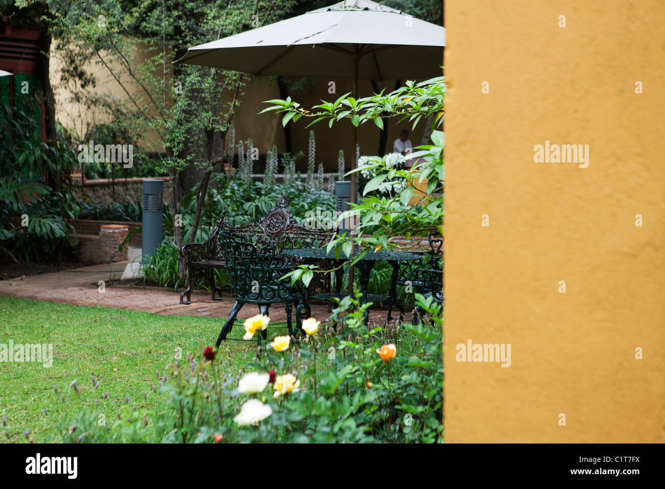 Patio furniture in garden Stock Photo - Alamy