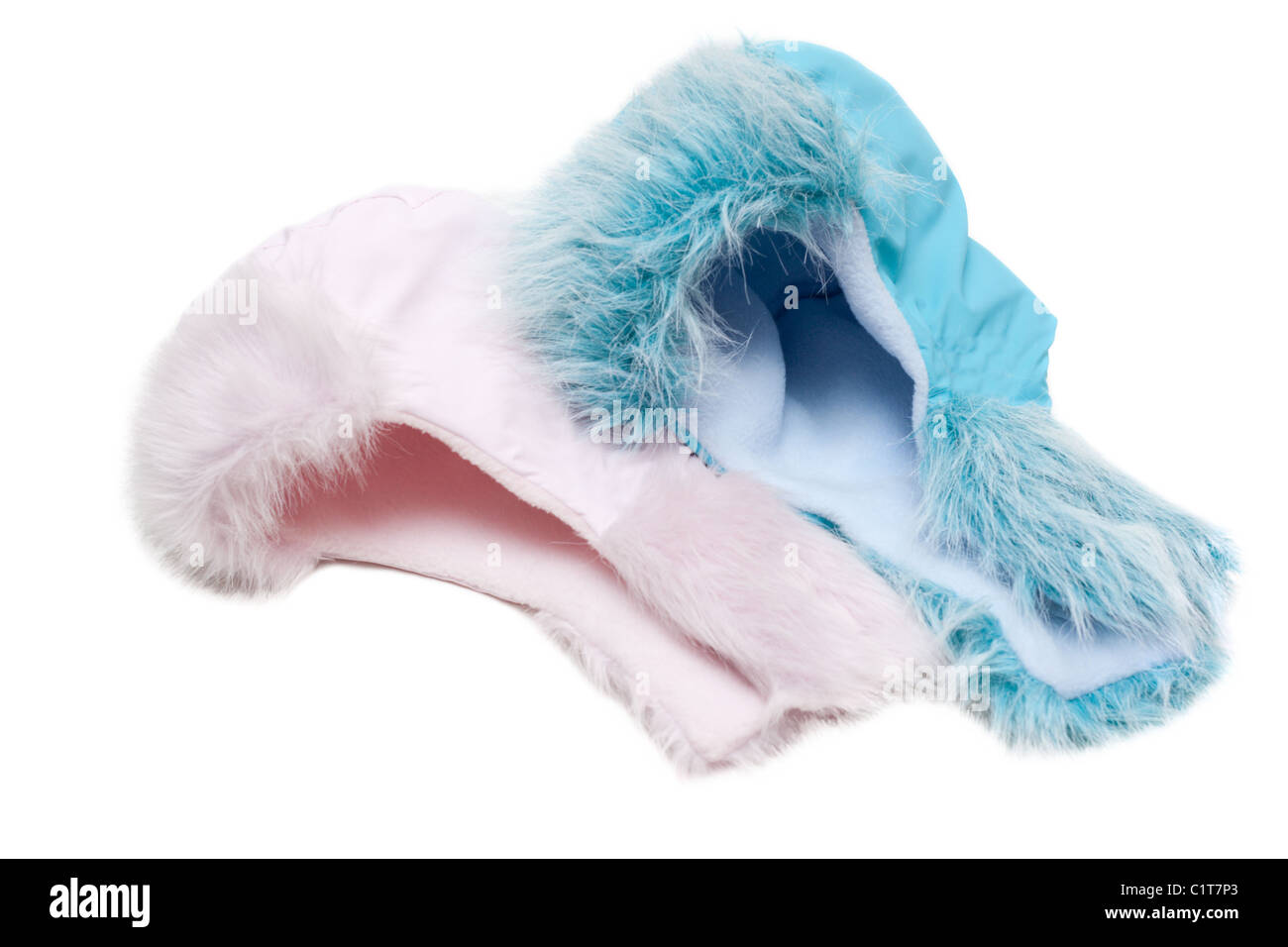 Two winter baby fur hats, rose and blue on white background Stock Photo