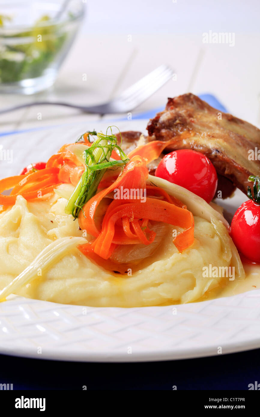 Mashed potato served as side dish to roast pork ribs Stock Photo Alamy