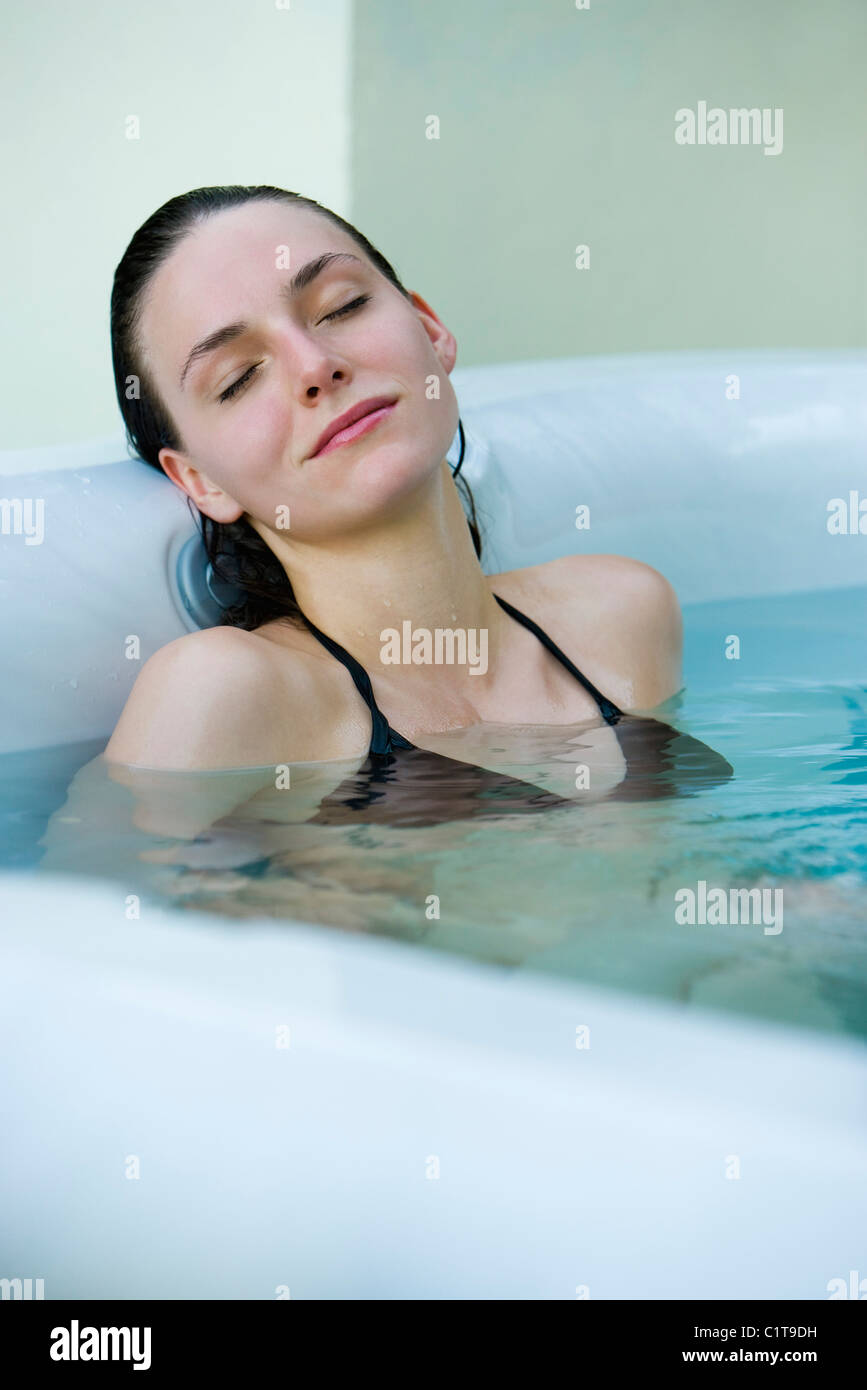 Woman relaxing in bath Stock Photo