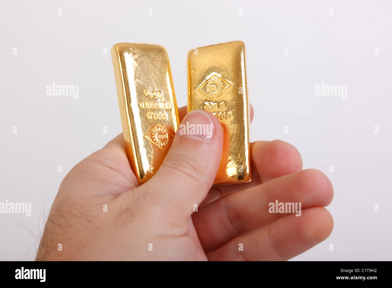 gold bars in hand Stock Photo Alamy