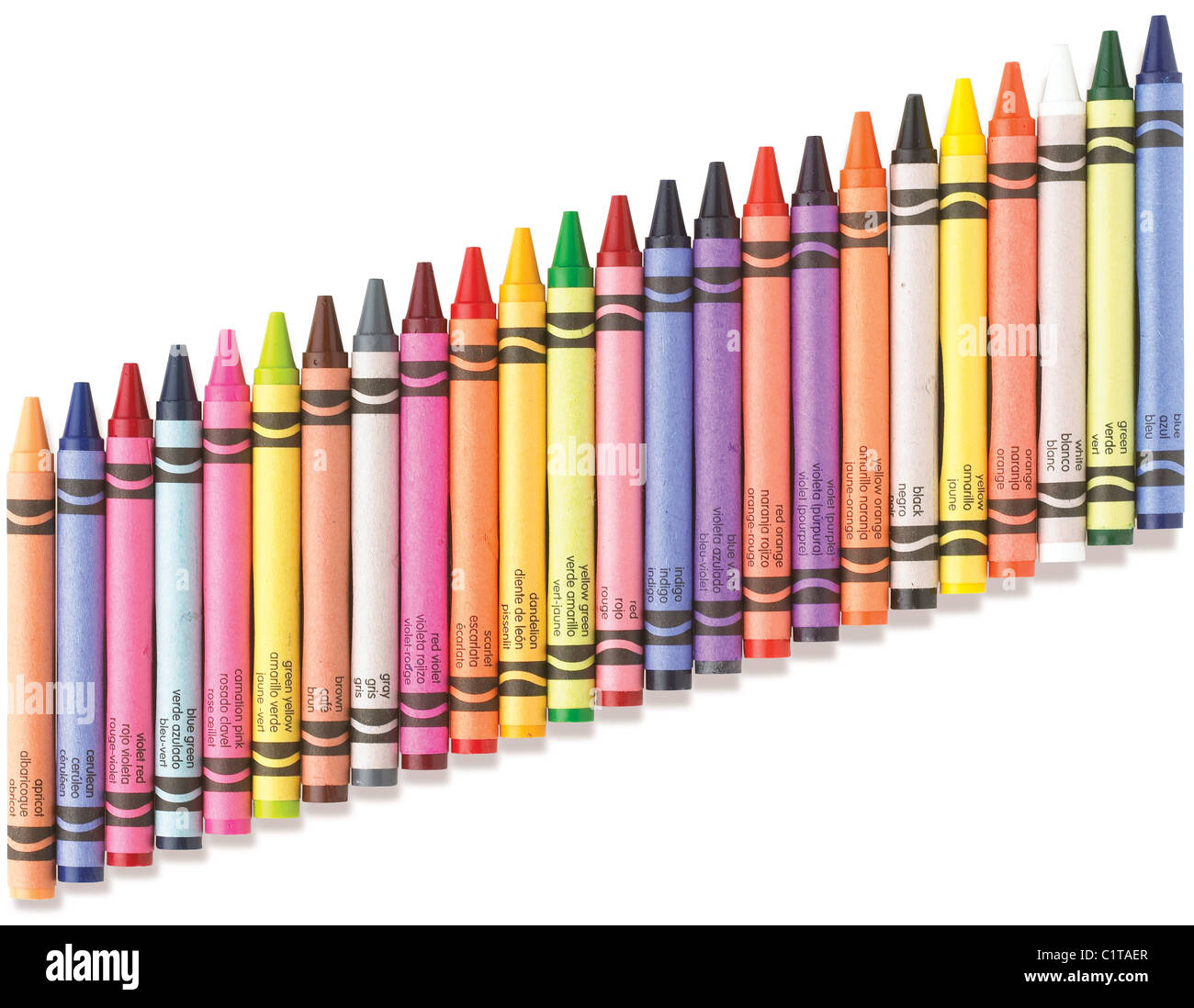 an angled row of colorful crayons on a white background with clipping path Stock Photo