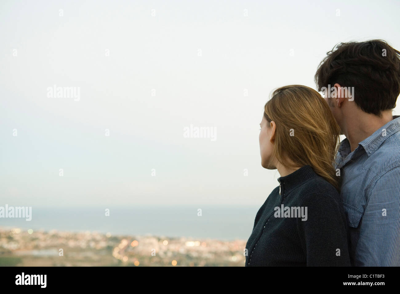 Young couple hugging admiring view hi-res stock photography and images ...