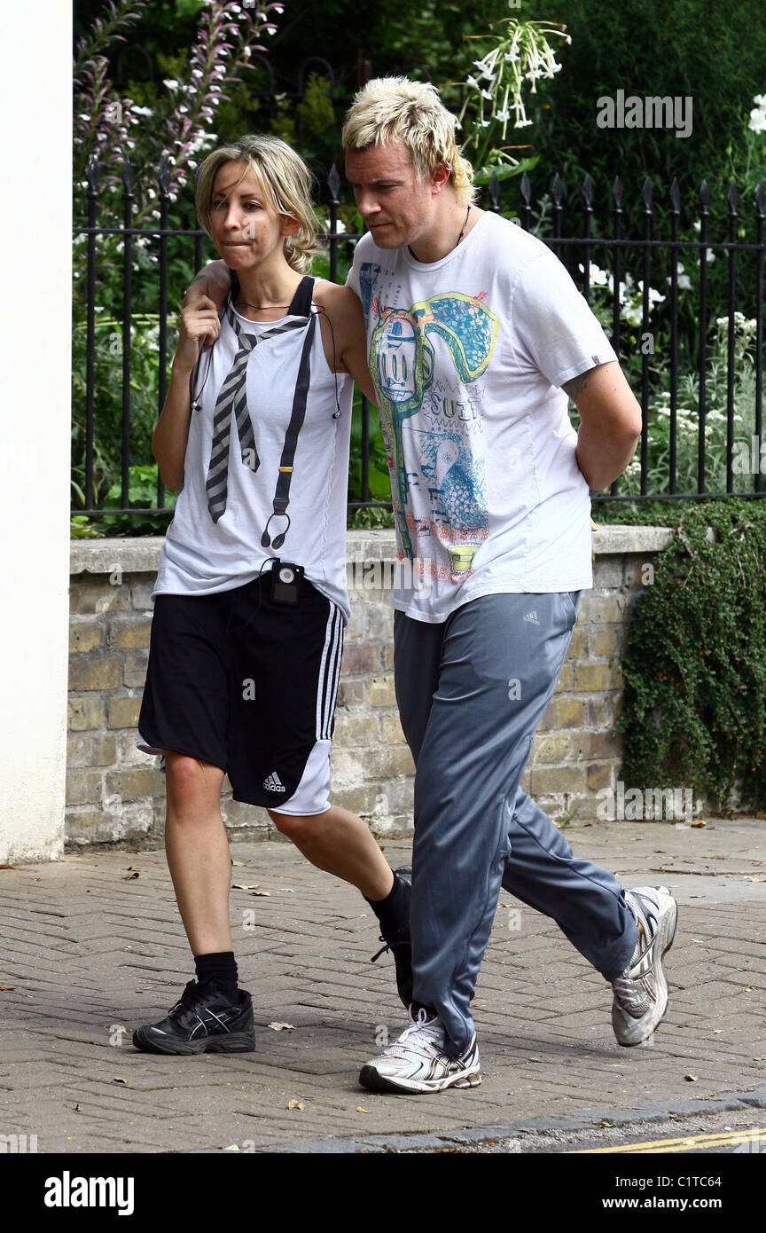 Natalie Appleton and Liam Howlett walk back from their local park after going for a morning run together London, England - Stock Photo