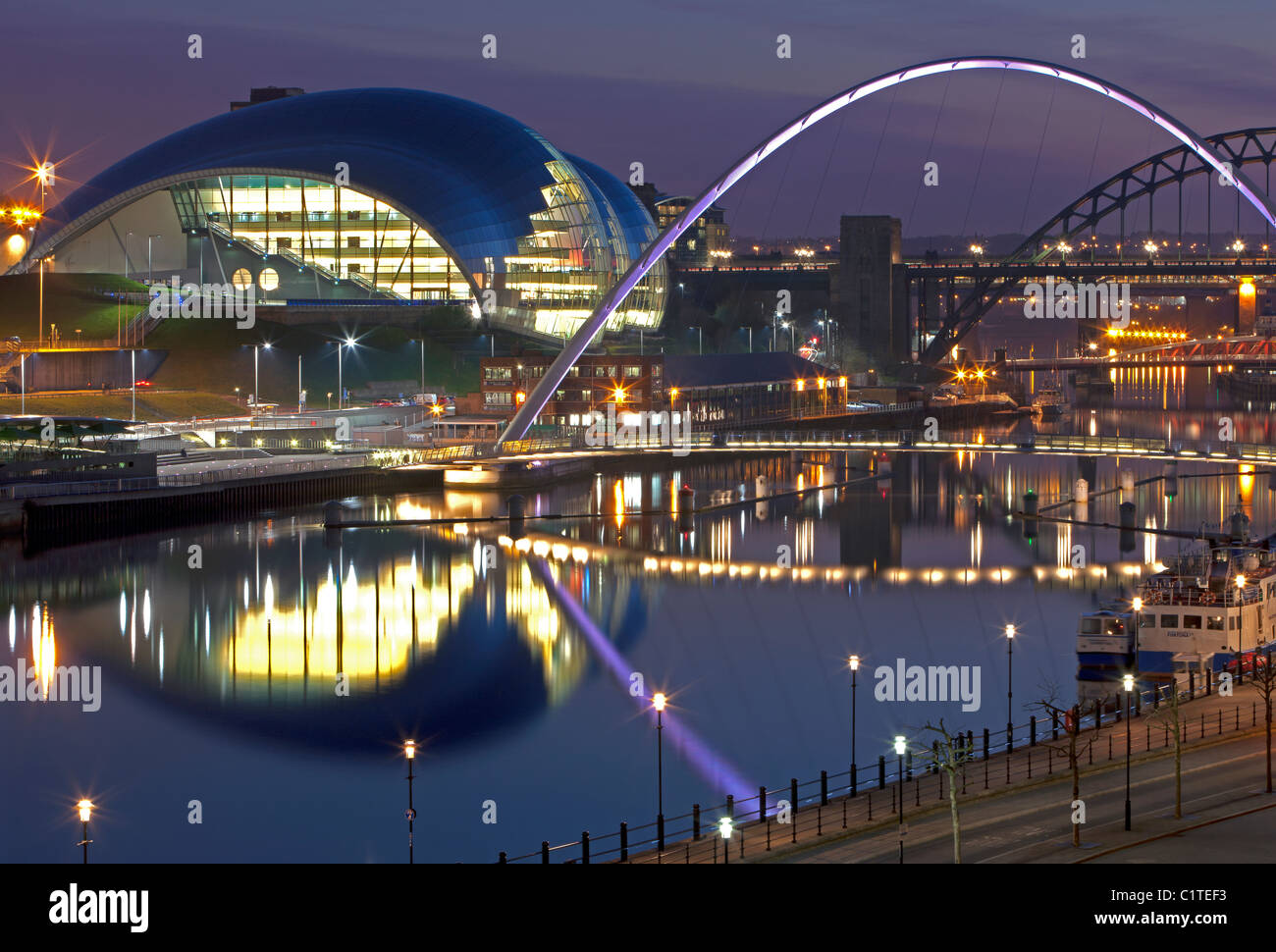 Nighttime reflections of the Sage Gateshead and Gateshead Millennium