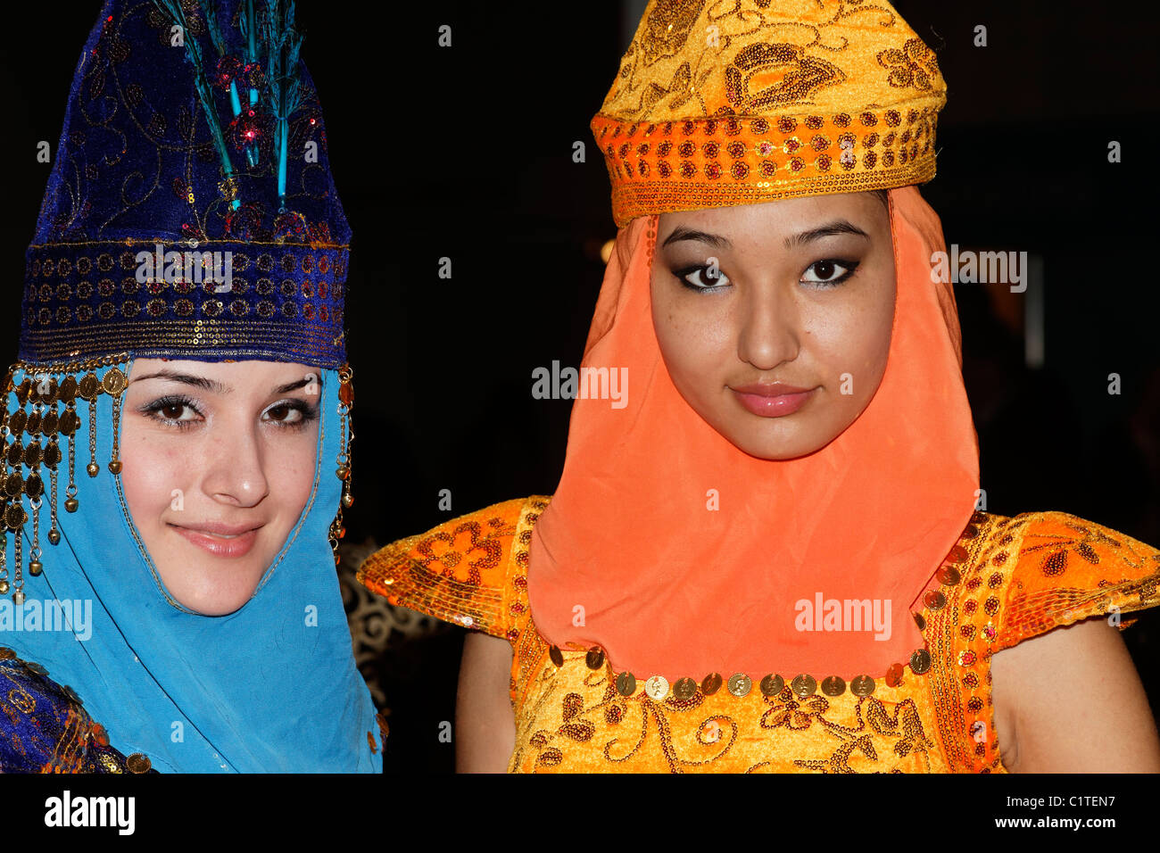 Portrait of 2 young women wearing traditional costumes of Kazakhstan. No third party rights available. ( NO MR ) | Stock Photo