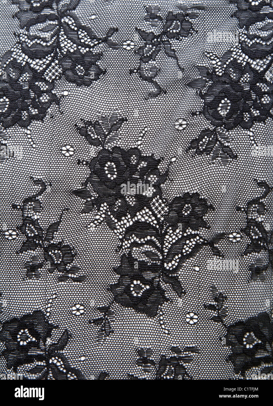 Black lace with pattern from flower on white background Stock Photo - Alamy