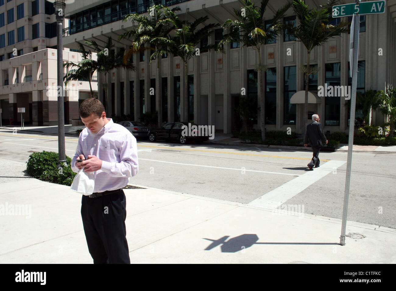 young professional texting on a smart  phone Stock Photo