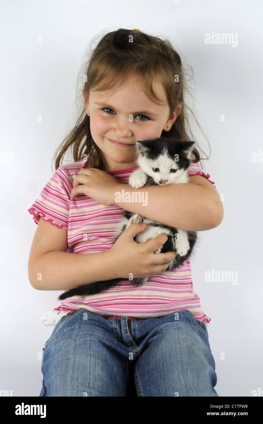 Girl with pet kitten Stock Photo