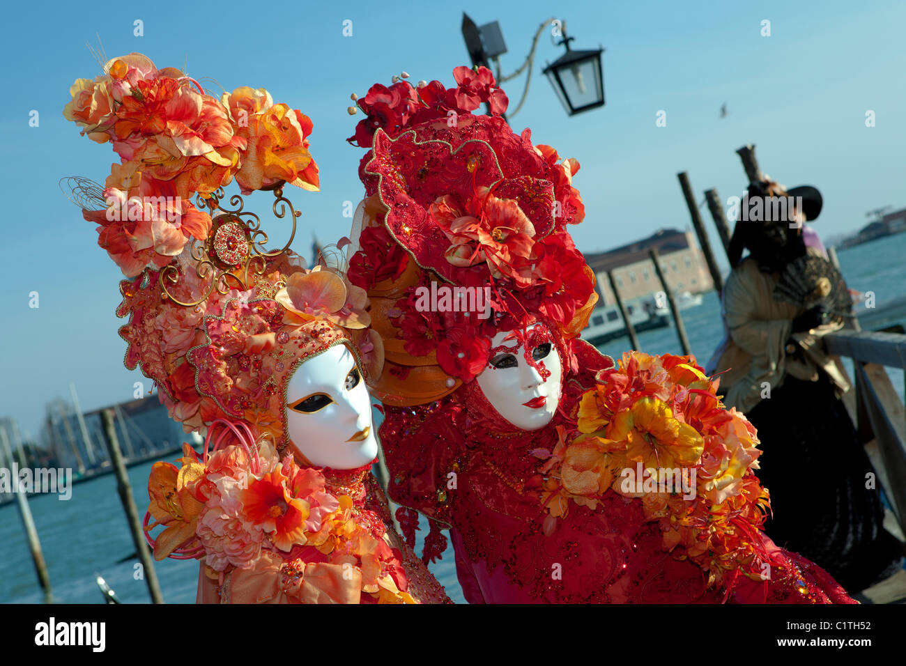 Venetian costumes and masks in carnival Stock Photo - Alamy