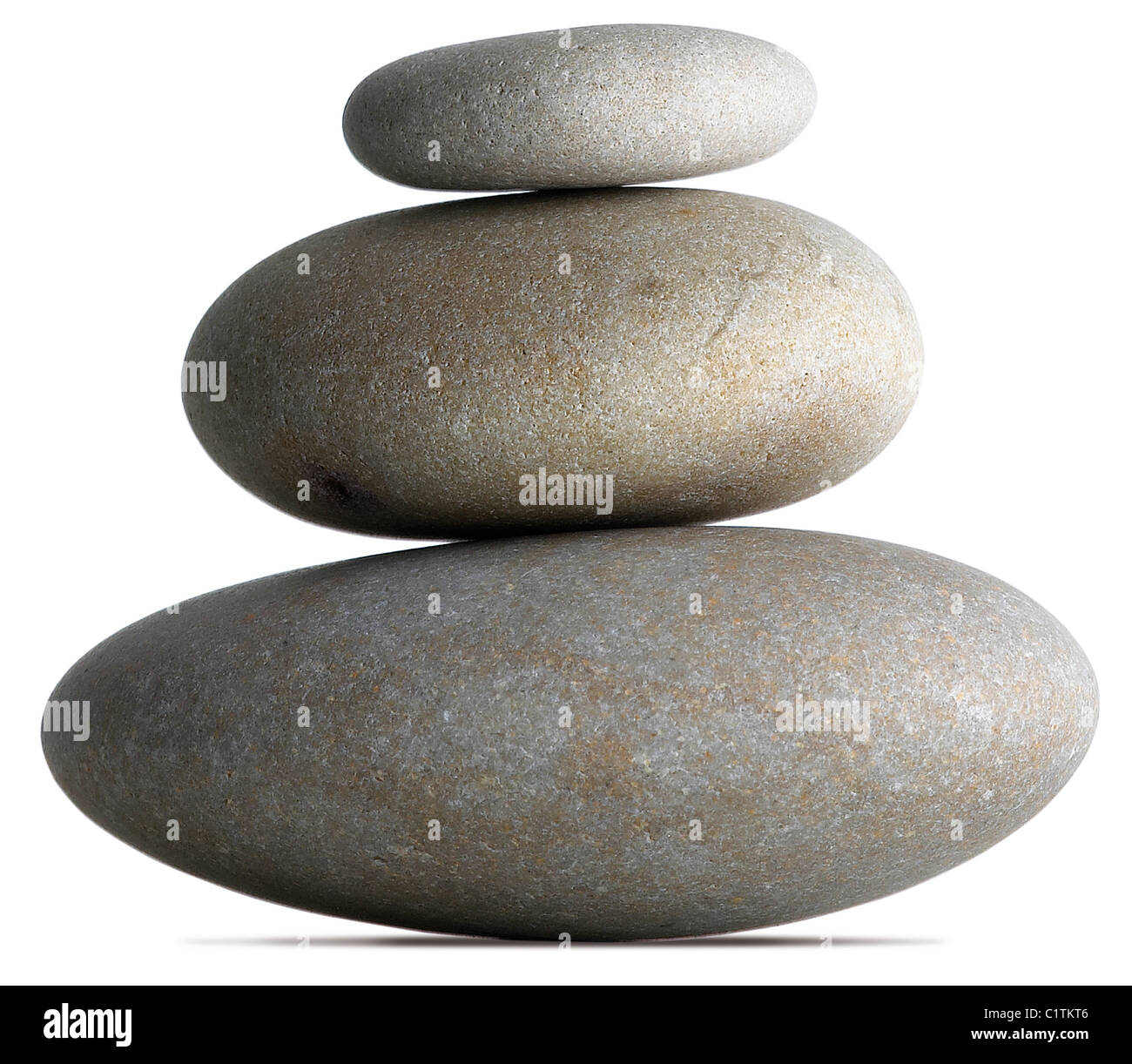 three balanced pebbles on a white background now with clipping path Stock Photo