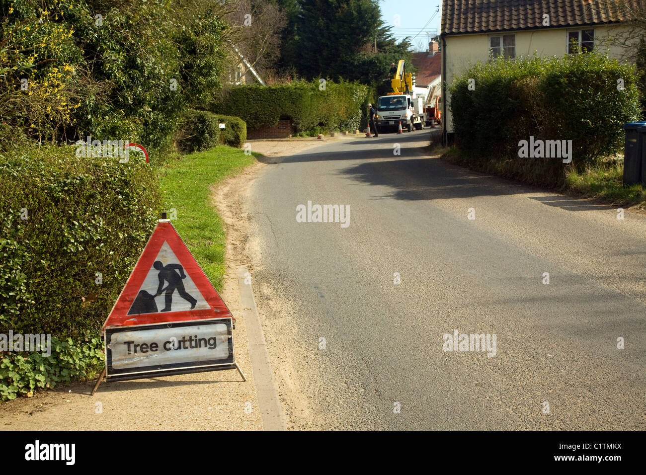 Tree cutting in operation sign village street Stock Photo