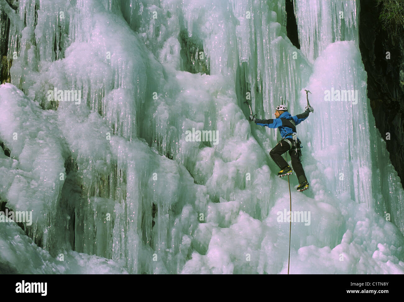 Man at ice climbing low angle view hi-res stock photography and images ...