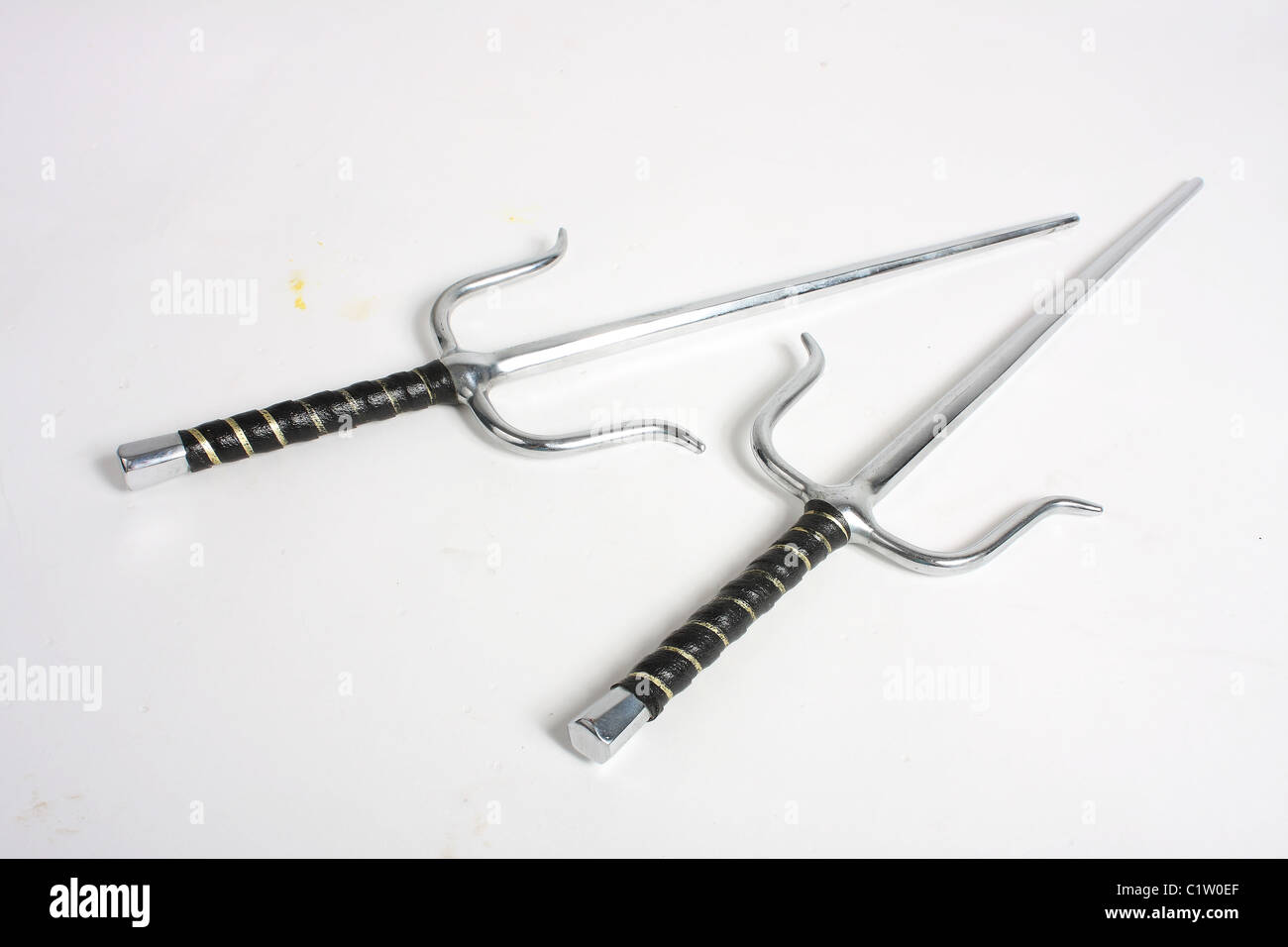 A pair of Egyptian style sai daggers; blunt for martial arts training and competitions. Stock Photo