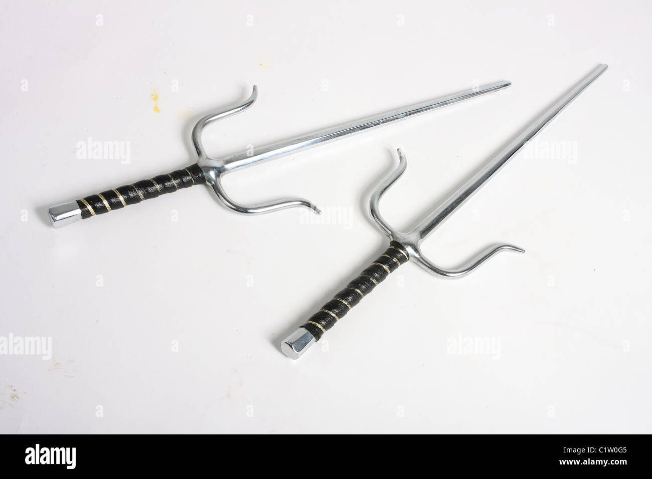 A pair of Egyptian style sai daggers; blunt for martial arts training and competitions. Stock Photo