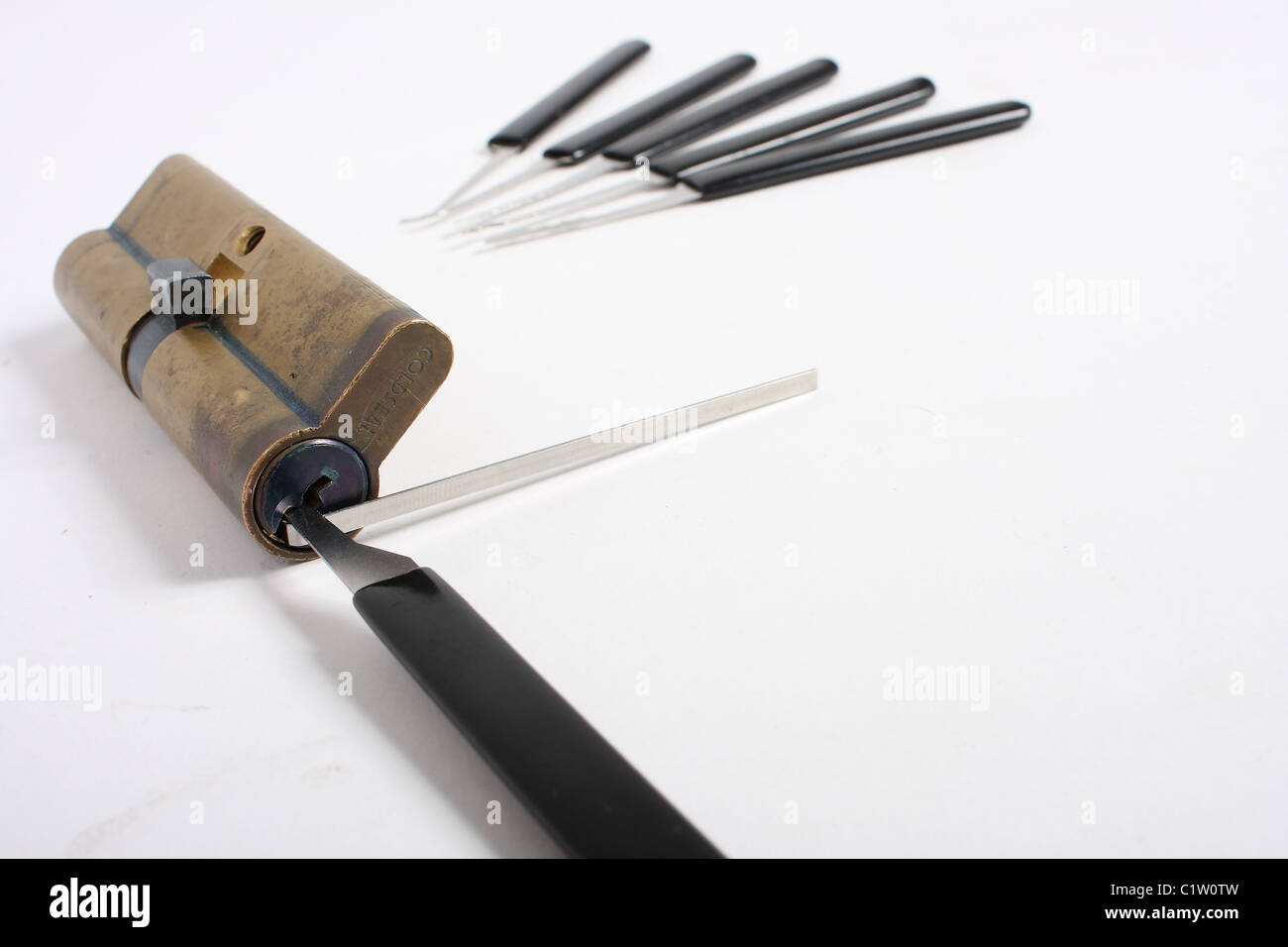 A set of amateur and professional lock picks; including a steel rake ...