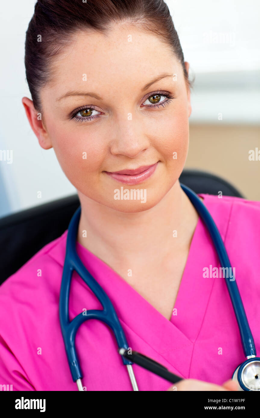 Sophisticated female surgeon smiling at the camera Stock Photo