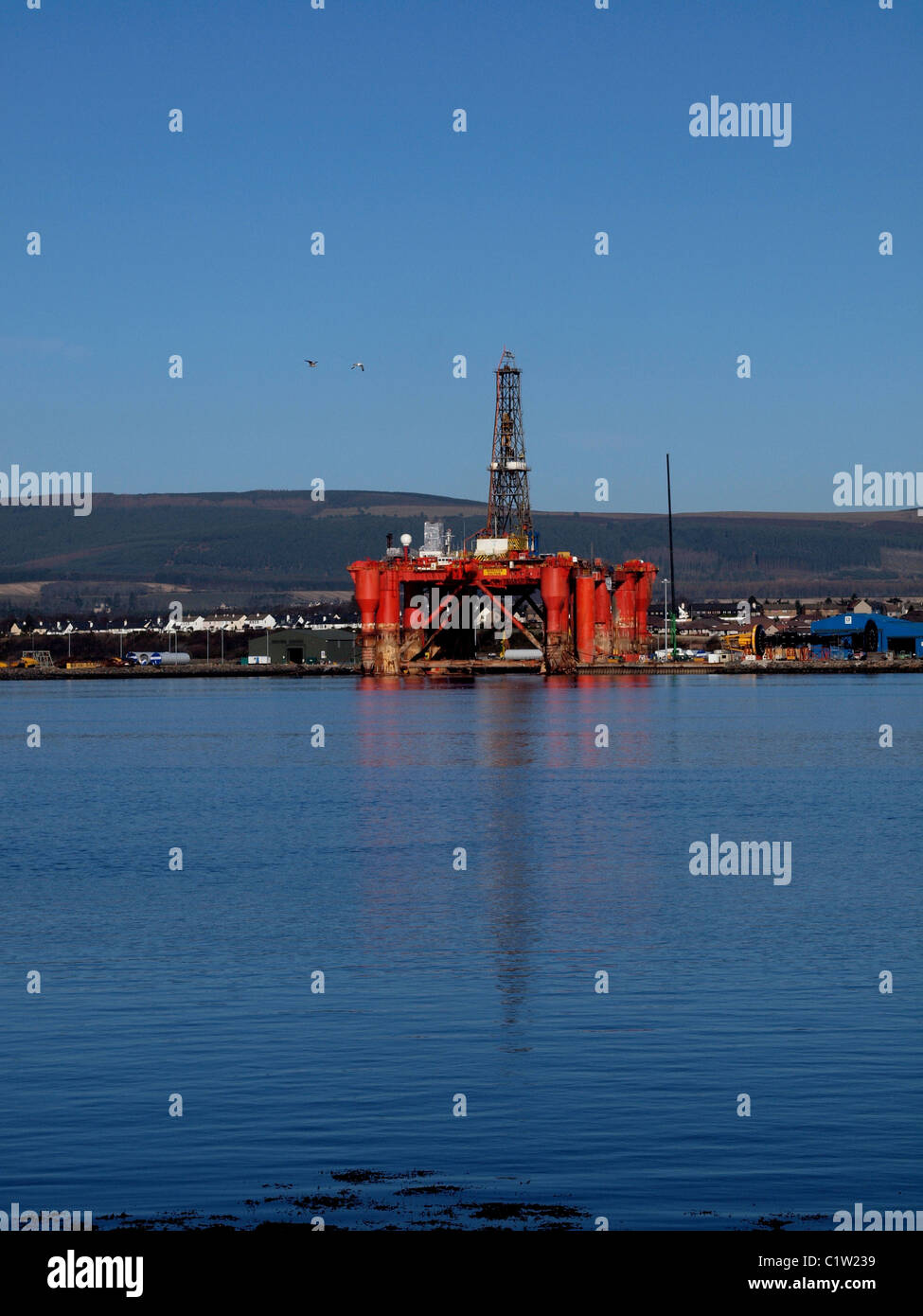The Queens Dock Invergordon, and a oil rig under repair Stock Photo - Alamy