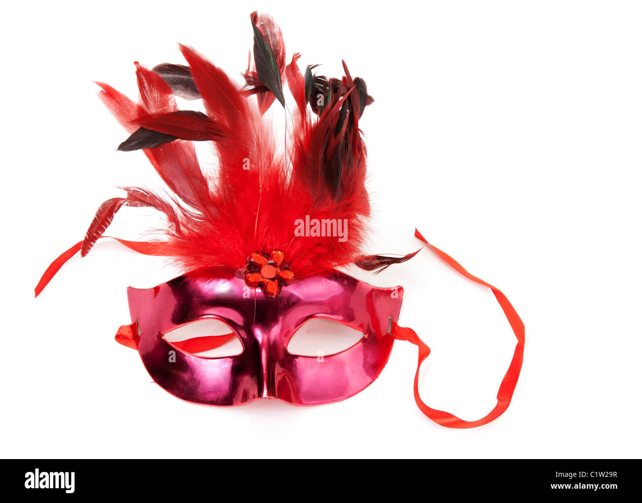 Red mask with feathers on a white background Stock Photo