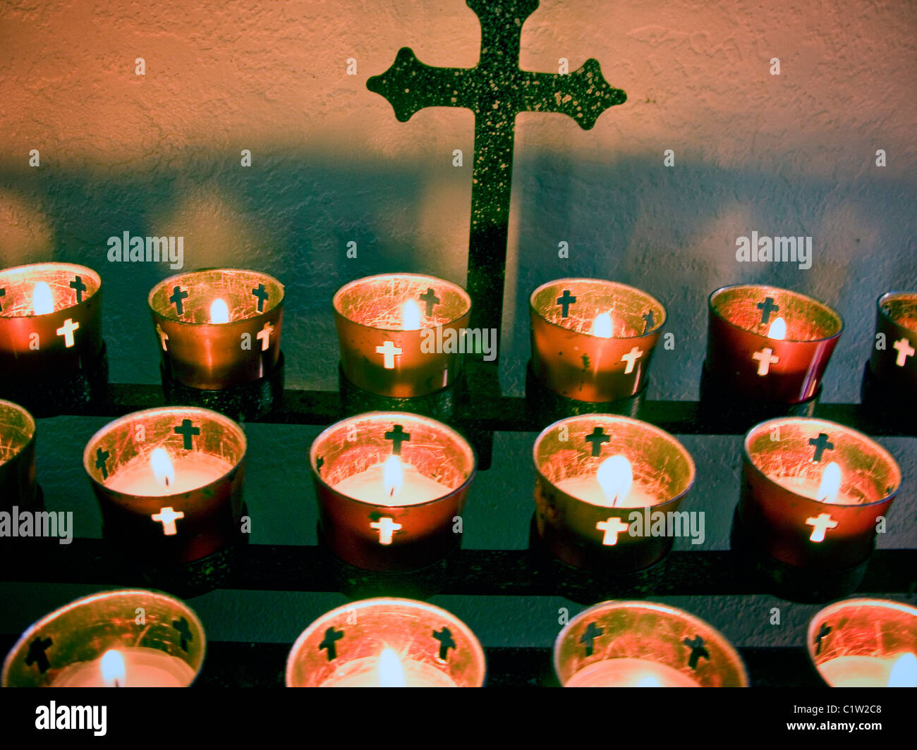 Burning votive candles in a catholic church Stock Photo Alamy