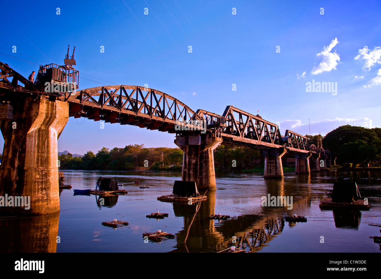 The Bridge Over The River Kwai still exists today. It is a viable railroad bridge that still carries frieght and passenger Stock Photo