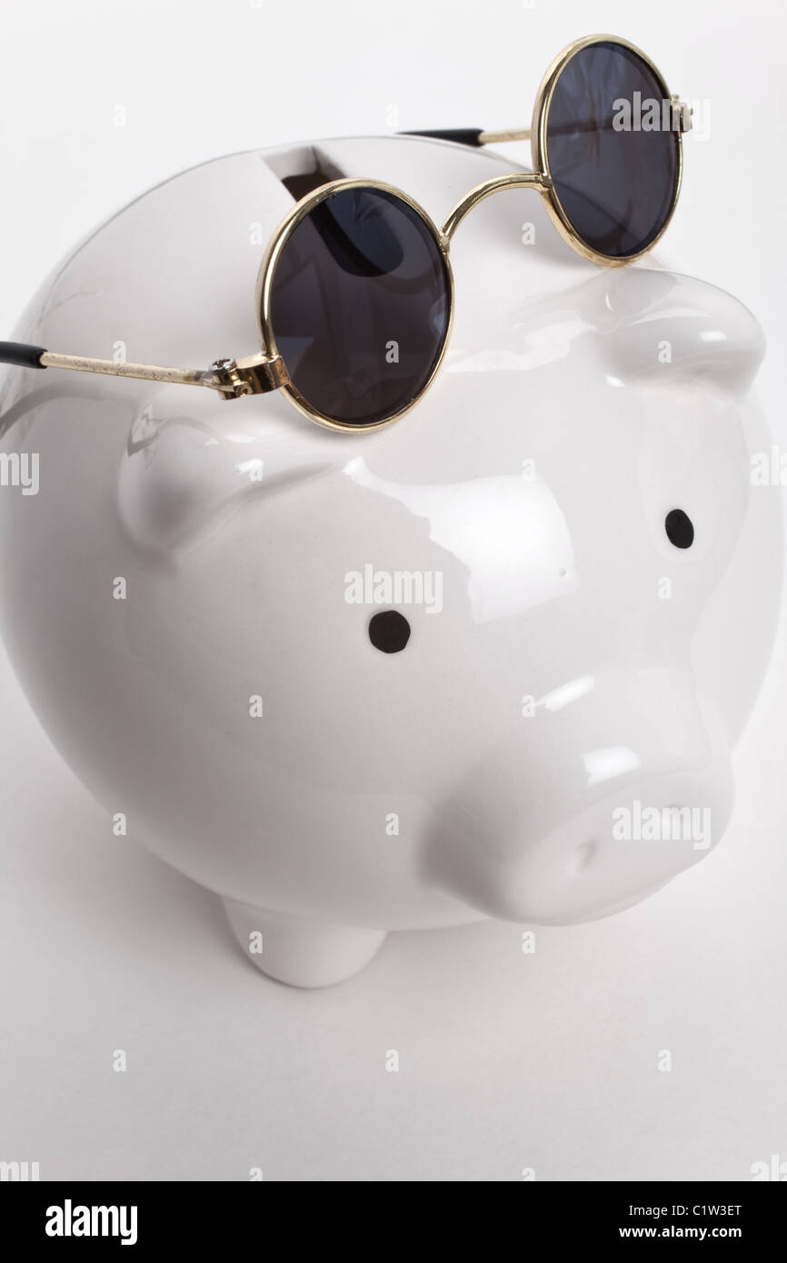 Piggy Bank and Sunglasses, concept of savings Stock Photo