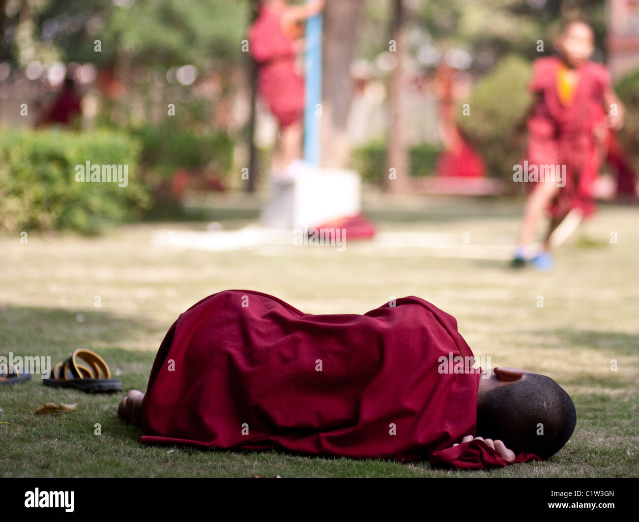 A young monk sleeping near the Bhutan monastery Stock Photo Alamy