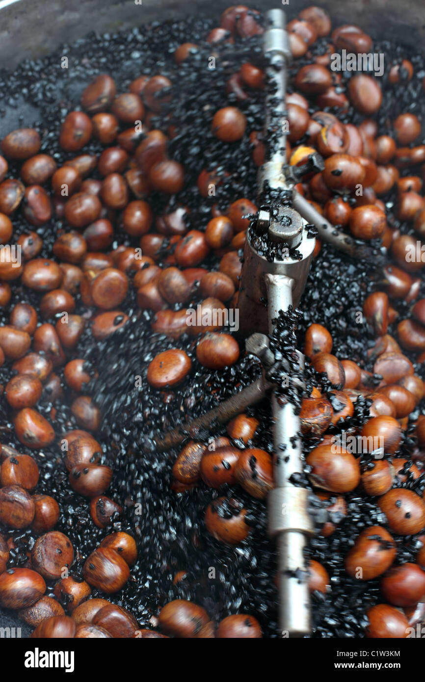 Chesnuts being roasted in coffee on Jalan Lekir in Chinatown. Stock Photo