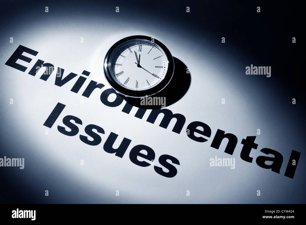 Clock and word of Environmental Issues for background Stock Photo