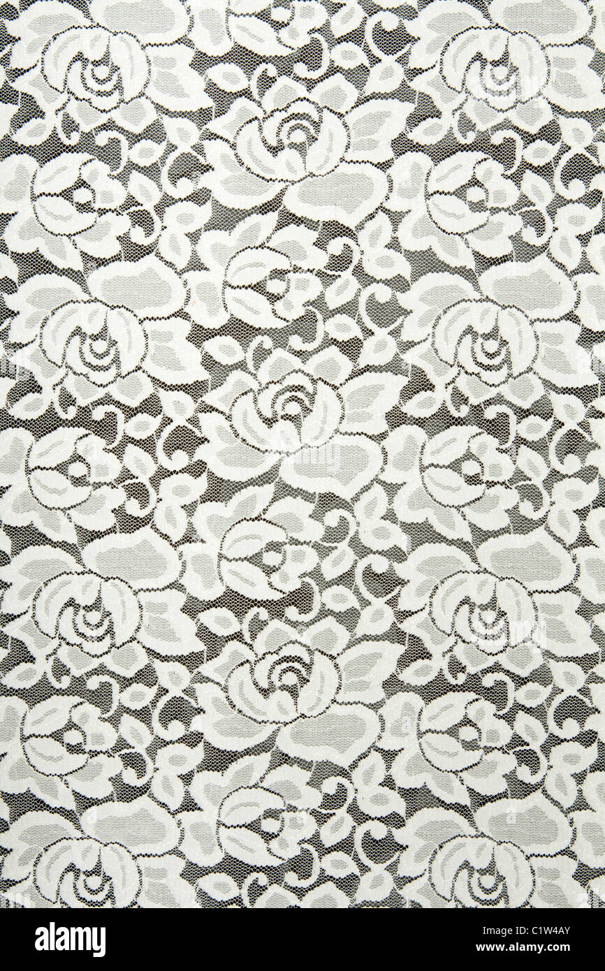 White lace with floral pattern on black background Stock Photo - Alamy