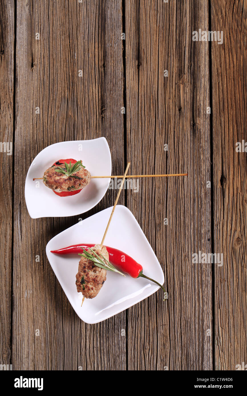 Minced meat kebabs on sticks - overhead Stock Photo