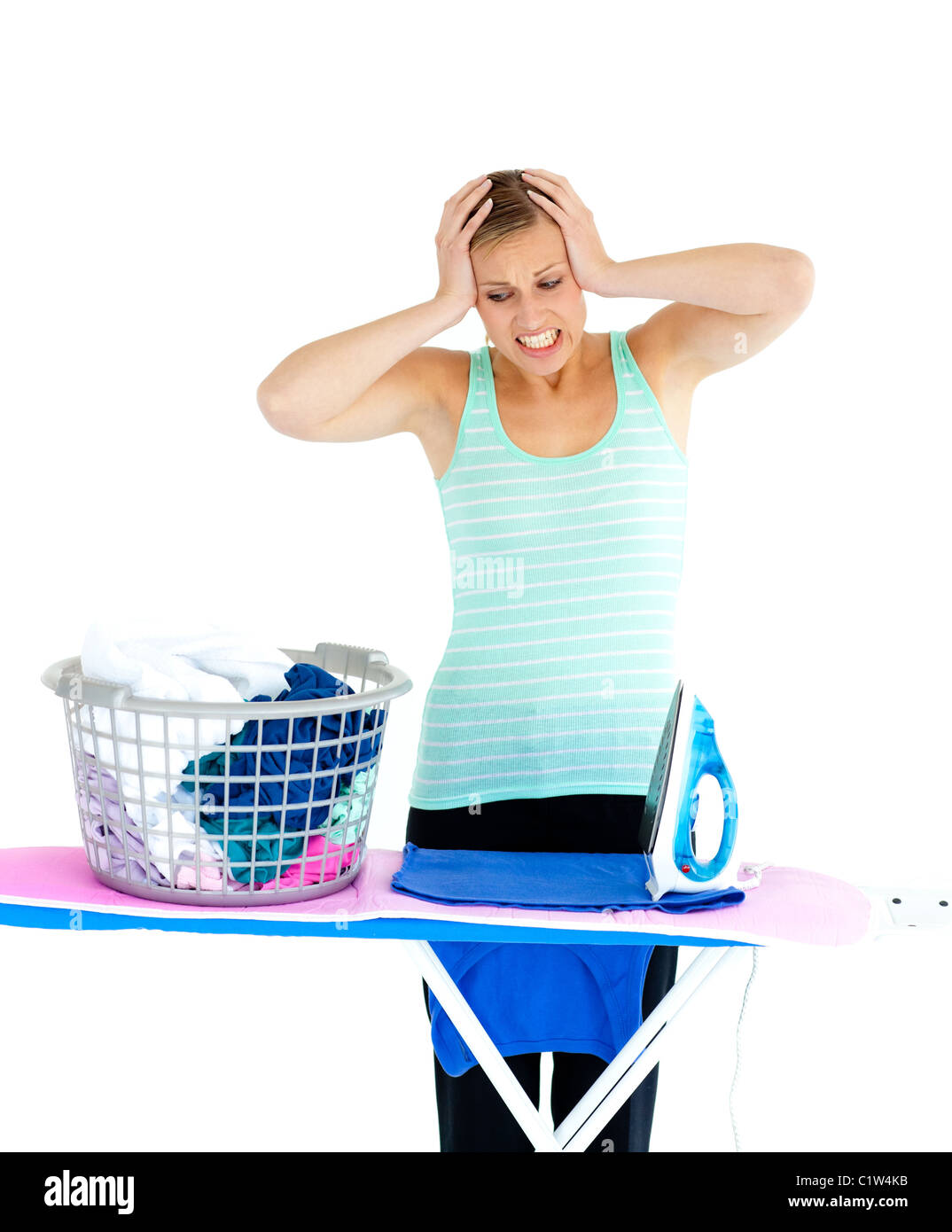 Unhappy woman ironing her clothes Stock Photo Alamy
