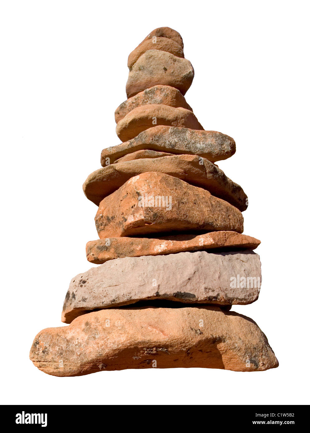 A rock cairn made to mark a nature trail siloed from its background. Stock Photo