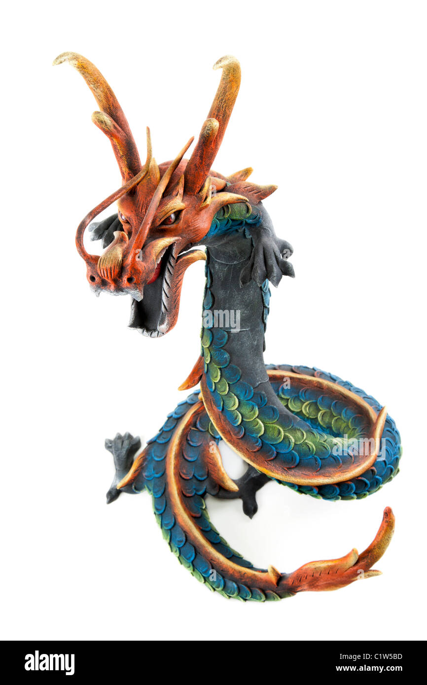 Wooden dragon with open mouth and horn on white background Stock Photo