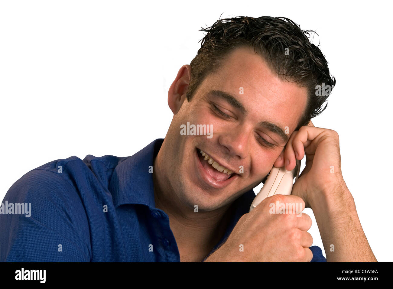 Man having a fun conversation on the phone. Stock Photo