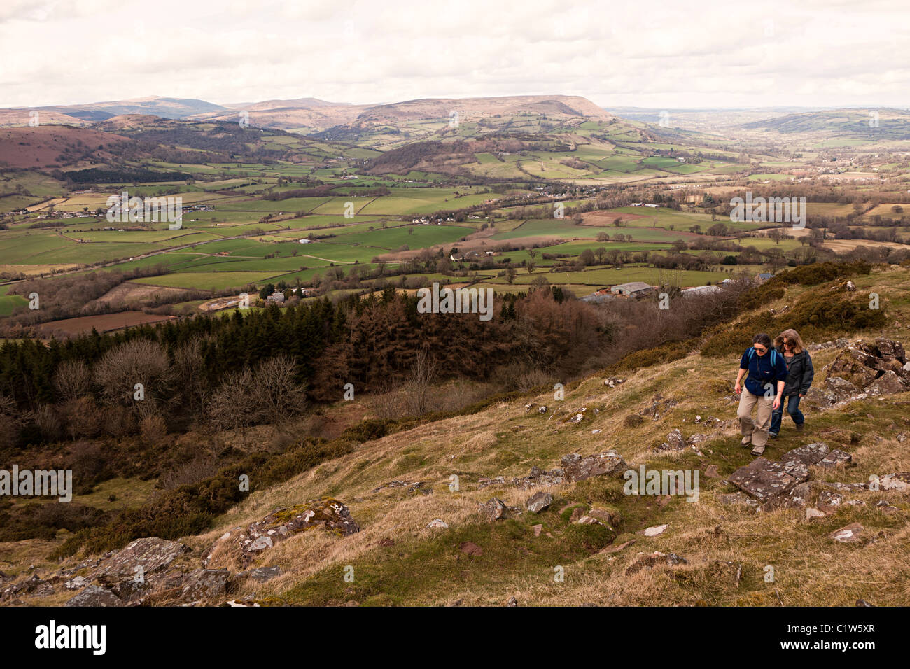 Two female walkers on the slopes of the Skirrid Wales UK Stock Photo