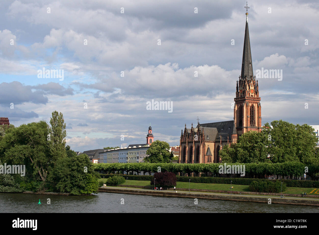A church on the banks of the Main River in Frankfurt, Germany. Stock Photo