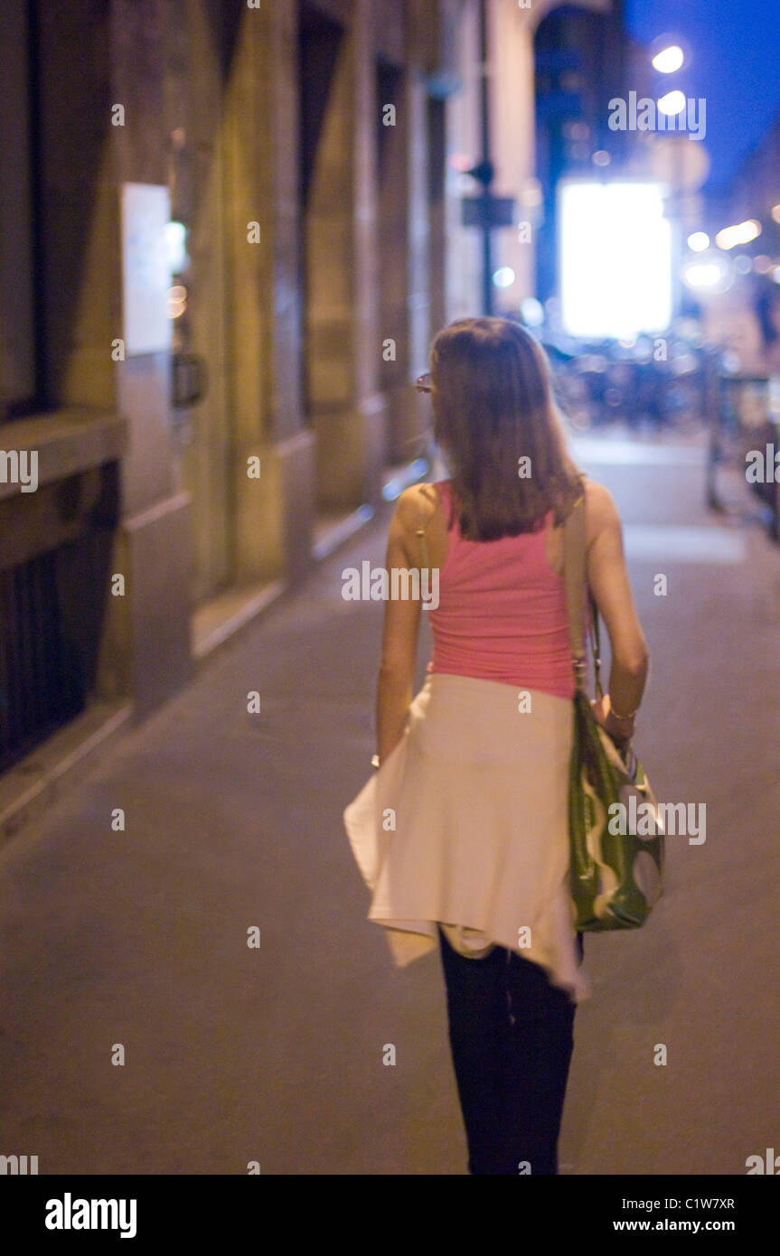 Woman walk in street night hi-res stock photography and images - Alamy
