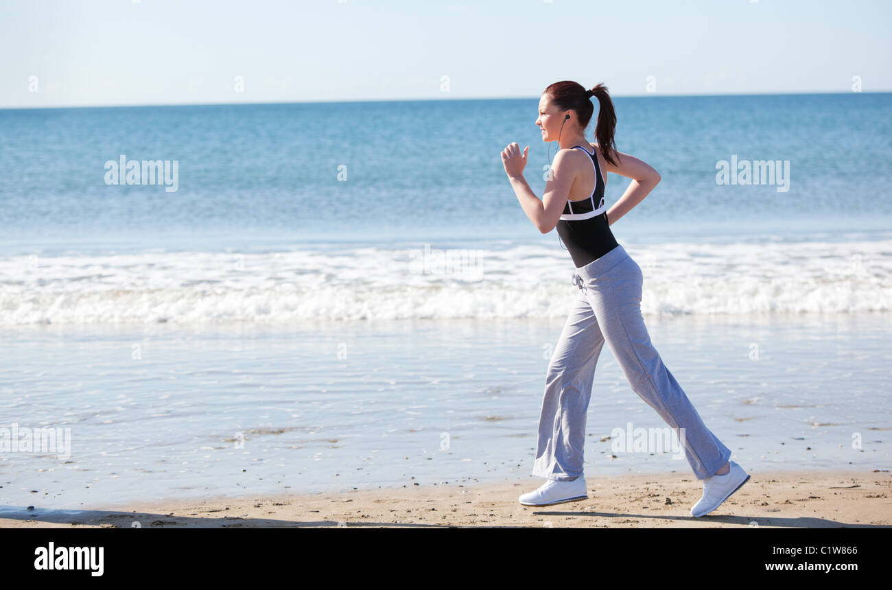 Beautifull woman running on the beach Stock Photo Alamy