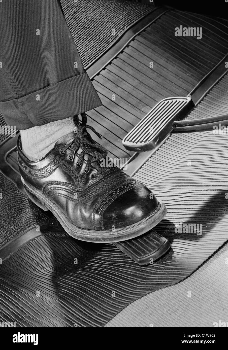 Mans foot on car accelerator pedal Stock Photo Alamy