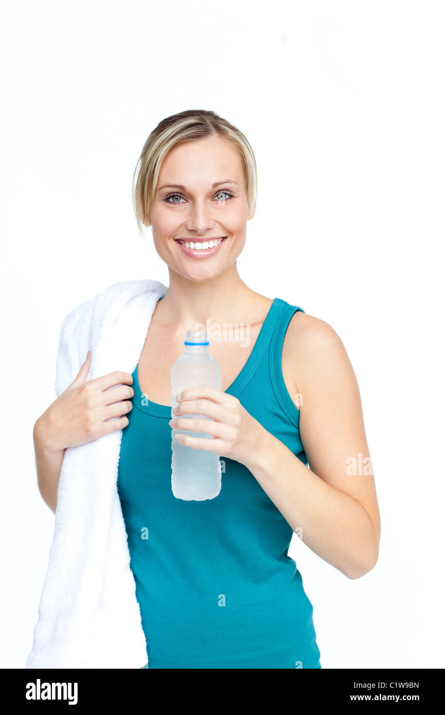 Smiling young woman with a bottle of water and a towel Stock Photo - Alamy