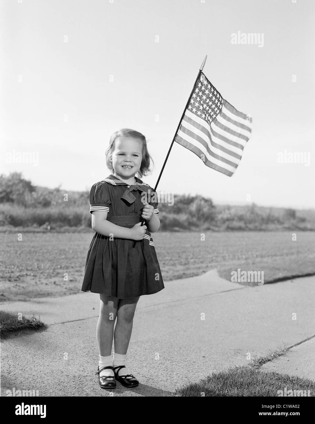Girl holding US flag Stock Photo Alamy